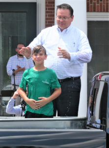 IN OBEDIENCE — Pastor Ed King baptizes Hayden Cannon June 14 in a water trough in the back of a pickup truck in the parking lot of Bay Springs Church, Bay Springs. (Special to The Baptist Record)